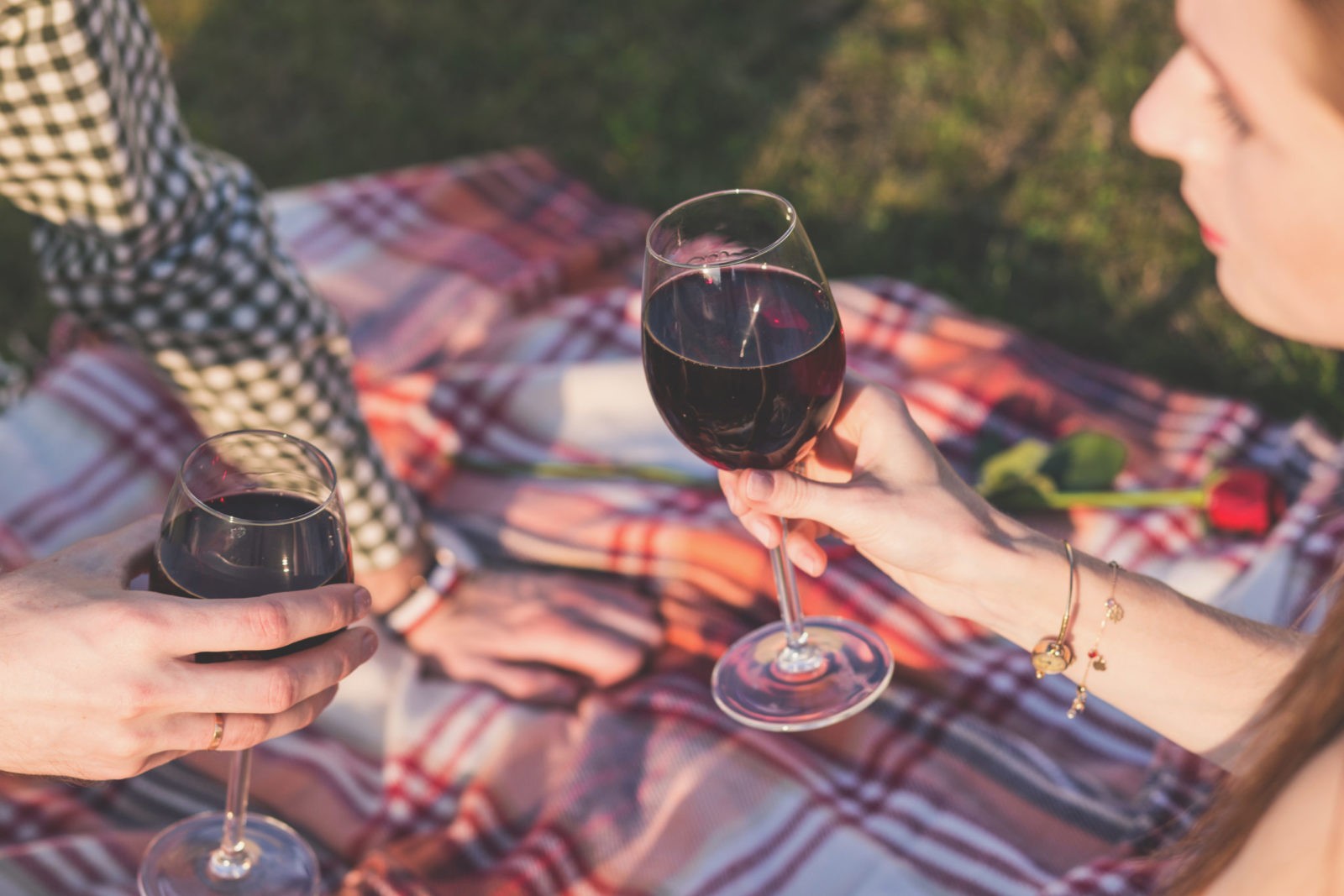 Canva - Two Person Holding Wine Glasses Outdoor