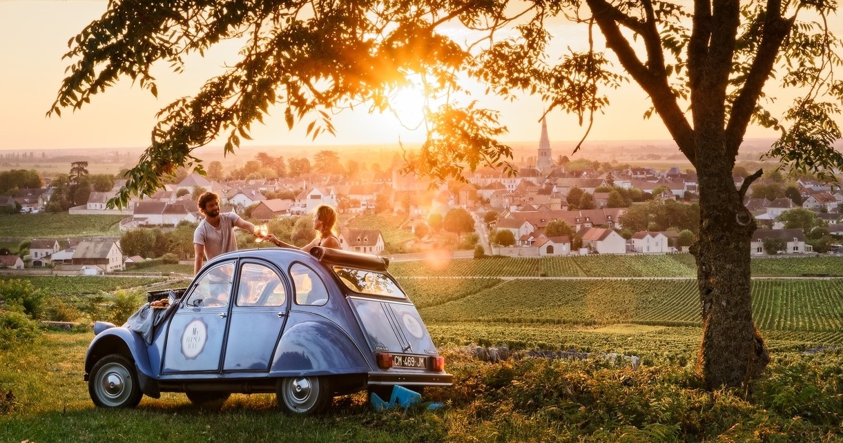 Drink in the vineyard in a vintage van